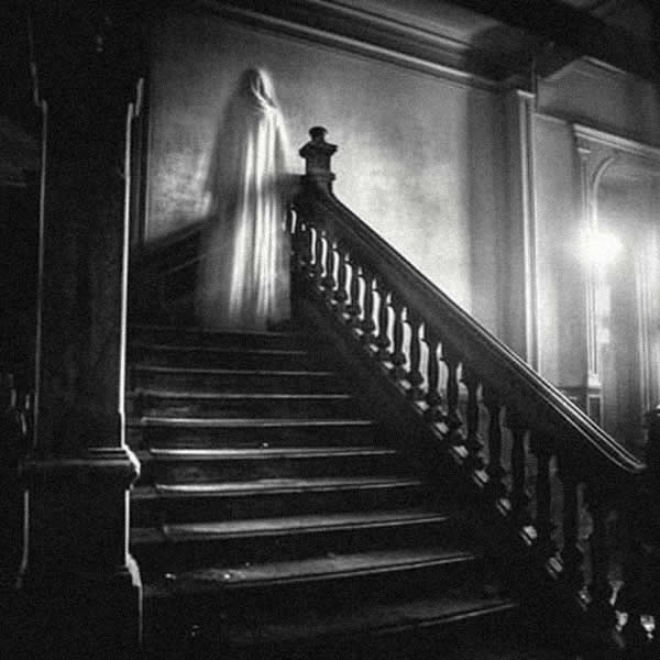 Ghost on the staircase of a mansion