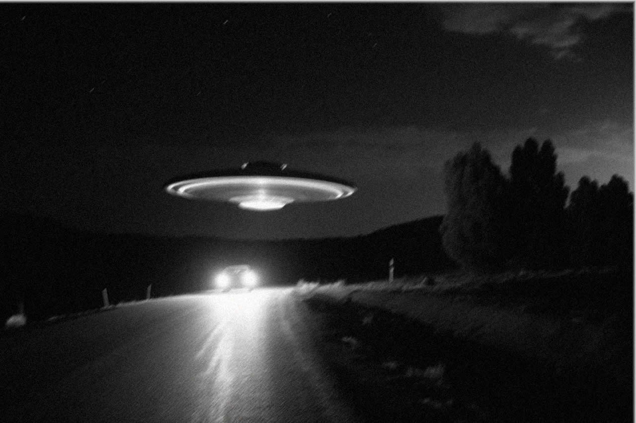 Picture of a UFO on a country road